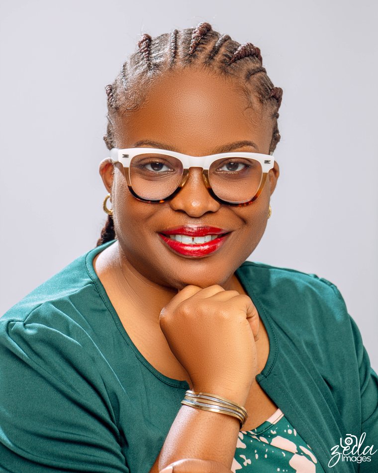 Professor Omosivie Maduka smiling, seated in her office